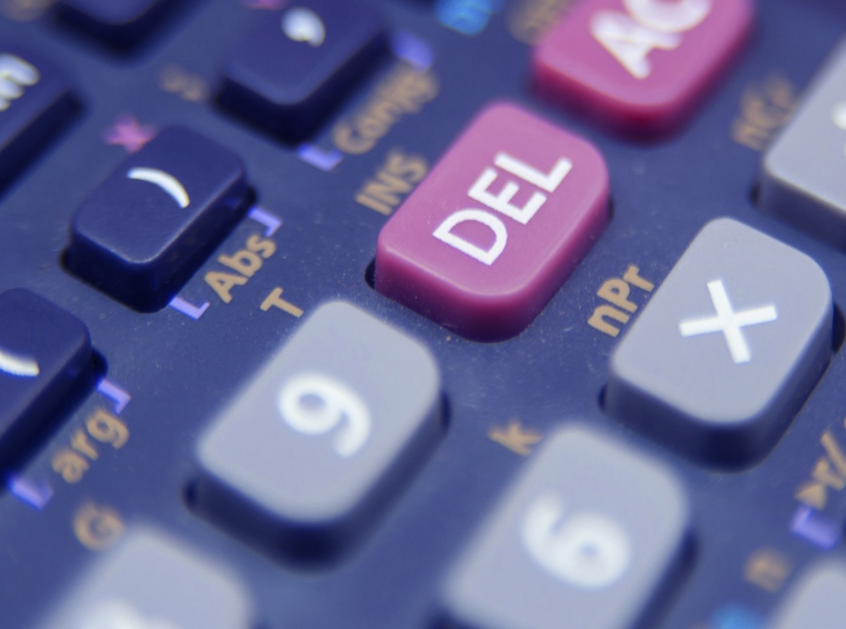 Forex trader calculating position size and stop-loss with formulas and charts for risk management.